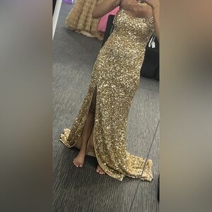gold sequence size 4 dress..... not altered in any way... tie open back